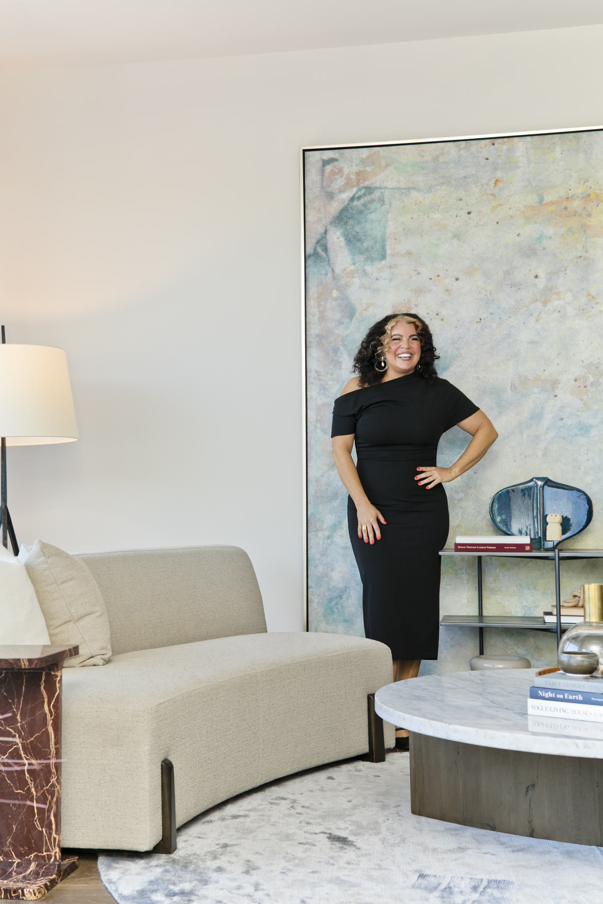 Katina Benenate smiling in an elegant living space
